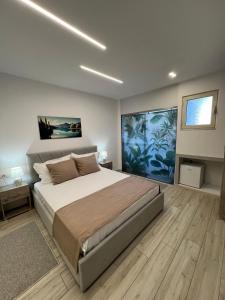 Postel nebo postele na pokoji v ubytování Coral Home
