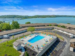 an aerial view of a resort with a swimming pool and a lake at Oasis on Table Rock Lake in Kimberling City