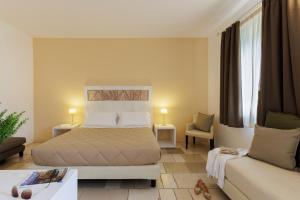 Postel nebo postele na pokoji v ubytování Masseria Corda Di Lana Hotel & Resort