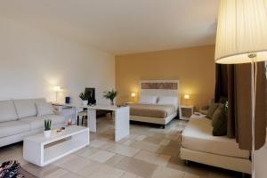 Postel nebo postele na pokoji v ubytování Masseria Corda Di Lana Hotel & Resort