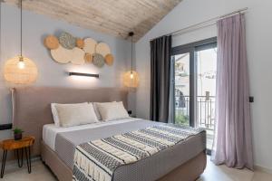 Posteľ alebo postele v izbe v ubytovaní De Bosset Suites Kefalonia