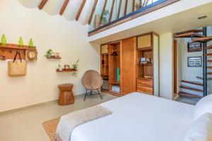 Кровать или кровати в номере Mezzanine Tulum, a Small Luxury Hotel