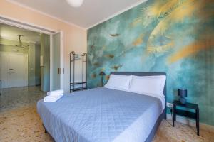 En eller flere senge i et værelse på Casa Preziosa in Metro Piramide