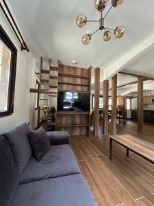 a living room with a couch and a table at Vadi Bungalow in Uzungöl