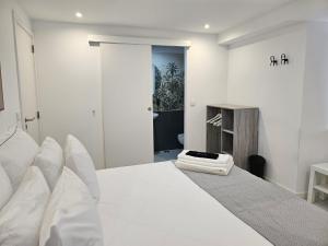 Ένα ή περισσότερα κρεβάτια σε δωμάτιο στο DoTejo Casa