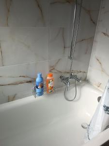 a bathroom sink with a faucet and a mirror at Mon Amour Apartment in Interlaken +12 photos