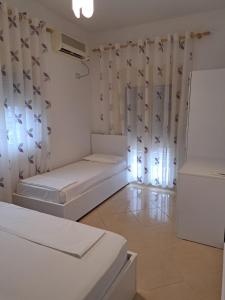 Postel nebo postele na pokoji v ubytování Bello Apartaments