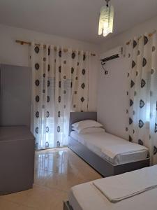Postel nebo postele na pokoji v ubytování Bello Apartaments