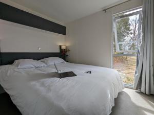 Postel nebo postele na pokoji v ubytování Les Ventoulines