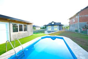a swimming pool in the backyard of a house at Apartment Lane in Bihać