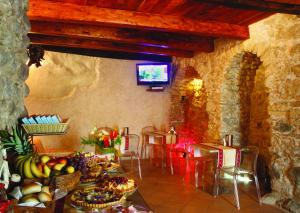 a room with a table filled with fruits and vegetables at Donnaciccina Accomodation in Tropea