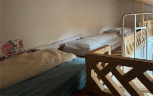 a bedroom with two bunk beds and a staircase at Interlaken saberana studio 11 in Interlaken