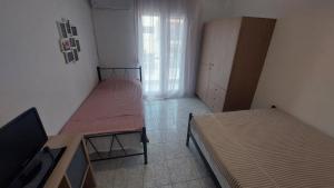 Postel nebo postele na pokoji v ubytování Makis Apartments Flogita