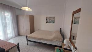 Postel nebo postele na pokoji v ubytování Makis Apartments Flogita