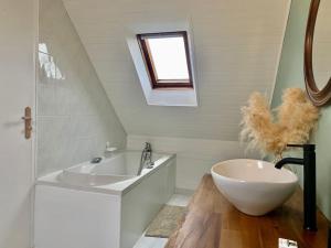 a white bathroom with a sink and a tub at Ty Glaz Lilia - La maison bleue in Plouguerneau +38 photos
