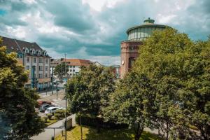 a building with a dome on top of a city at sunny & cozy - Netflix - WIFI - City - 4 Person in Essen