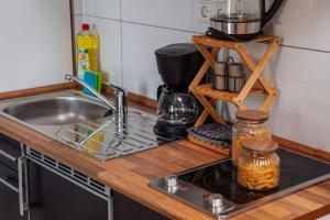 a kitchen counter top with a sink and a counter top at sunny & cozy - Netflix - WIFI - City - 4 Person in Essen +7 photos