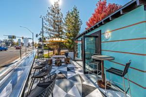 a patio with chairs and a bar on a building at Walkable Wonder Midtown Studio near Downtown Gems in Reno +17 photos