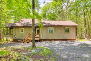 a small house in the middle of the forest at Clifton Township Home with Deck and Heated Sunroom! in Gouldsboro