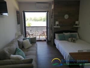 Postel nebo postele na pokoji v ubytování Ferias Apartmani
