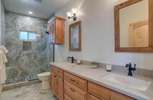 a bathroom with a sink and a shower at MountainAire in South Fork, CO in South Fork +44 photos