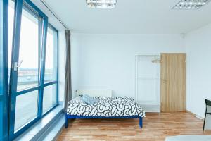 Postel nebo postele na pokoji v ubytování Hostel Metro Kabaty
