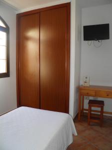 Posteľ alebo postele v izbe v ubytovaní Hostal Albacar