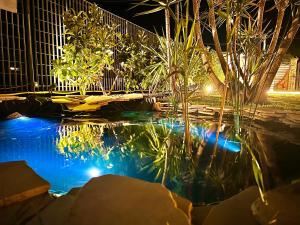 a pool of water with plants and lights at Villa Latino in Vieste