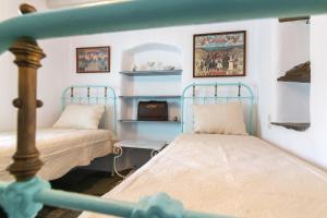 A bed or beds in a room at Galatea House Katoï with patio
