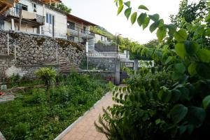 a brick walkway in front of a building at Natural Zogaj in Shkodër