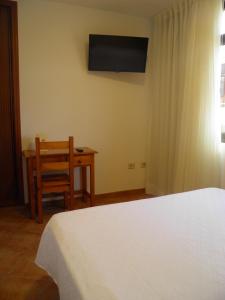Posteľ alebo postele v izbe v ubytovaní Hostal Albacar