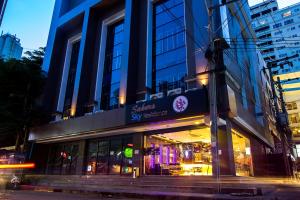 a store front of a building on a city street at Sakura Sky Residence in Bangkok
