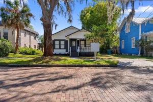 a brick driveway in front of a blue house at Downtown Orlando 1br Peaceful Convenient in Orlando +9 photos