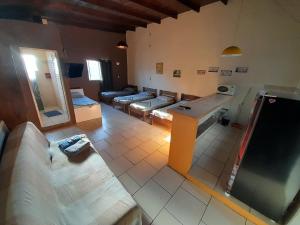 an aerial view of a living room with couches at JK QUITINETES ECONOMICO com garagem CENTRAL in Pelotas