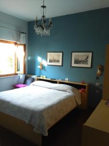 Postel nebo postele na pokoji v ubytování Albergo Villa Sorriso