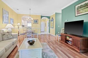 A television and/or entertainment centre at Coastal Calm Retreat