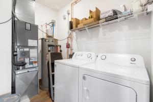 a laundry room with a washer and dryer at Private Hot Tub-Free Attraction Tickets-Lake Lookout-Community Indoor & Outdoor Pools in Branson +35 photos