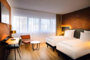 Postel nebo postele na pokoji v ubytování Tulip Inn Ludwigshafen City + 22 fotografií