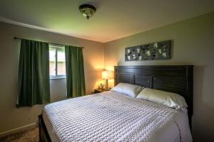 a bedroom with a large bed and a window at bp1 Sunny Sunny in Beavercreek