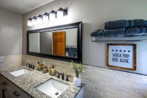 a bathroom with a sink and a mirror at bp1 Sunny Sunny in Beavercreek +34 photos