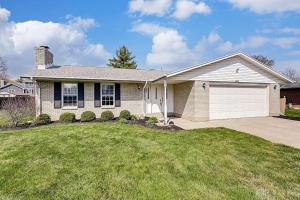 a house with a grass yard at bp1 Sunny Sunny in Beavercreek