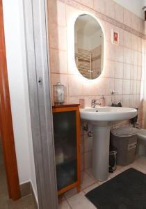 a bathroom with a sink and a mirror at A casa di Tina in Genzano di Roma