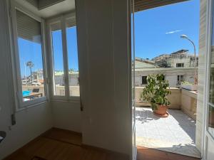 an empty room with a view of a balcony at La Dolce Vita 5 Star Luxury Sanremo in Sanremo