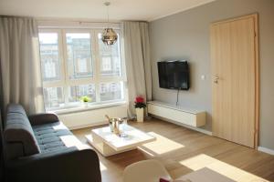 TV a/nebo společenská místnost v ubytování SMM Apartament Stettin