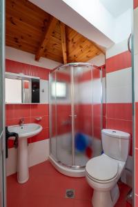a bathroom with a toilet and a sink at Villa Hamza Ksamil in Ksamil +169 photos