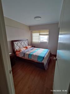 a bedroom with a bed in a room with a window at habitacion con camarote in Lima +4 photos