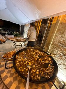 a large pile of food on top of a table at Demeure Sainte Clotilde, événementiel et chambres d'hôtes à Neffies in Néffiès