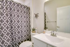 a bathroom with a toilet and a sink at Covered Patio, Grill and Hammock Frankford Home! in Frankford +18 photos