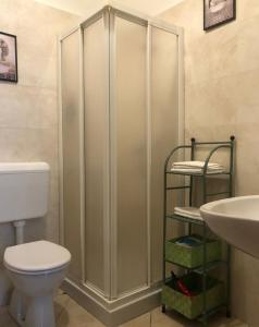 a bathroom with a toilet and a sink at Casa vivace in centro Torino by Turin House Collection in Turin