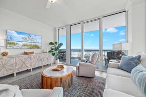 a living room with a couch and a table at Perdido Dunes Tower Unit 2W in Orange Beach +50 photos